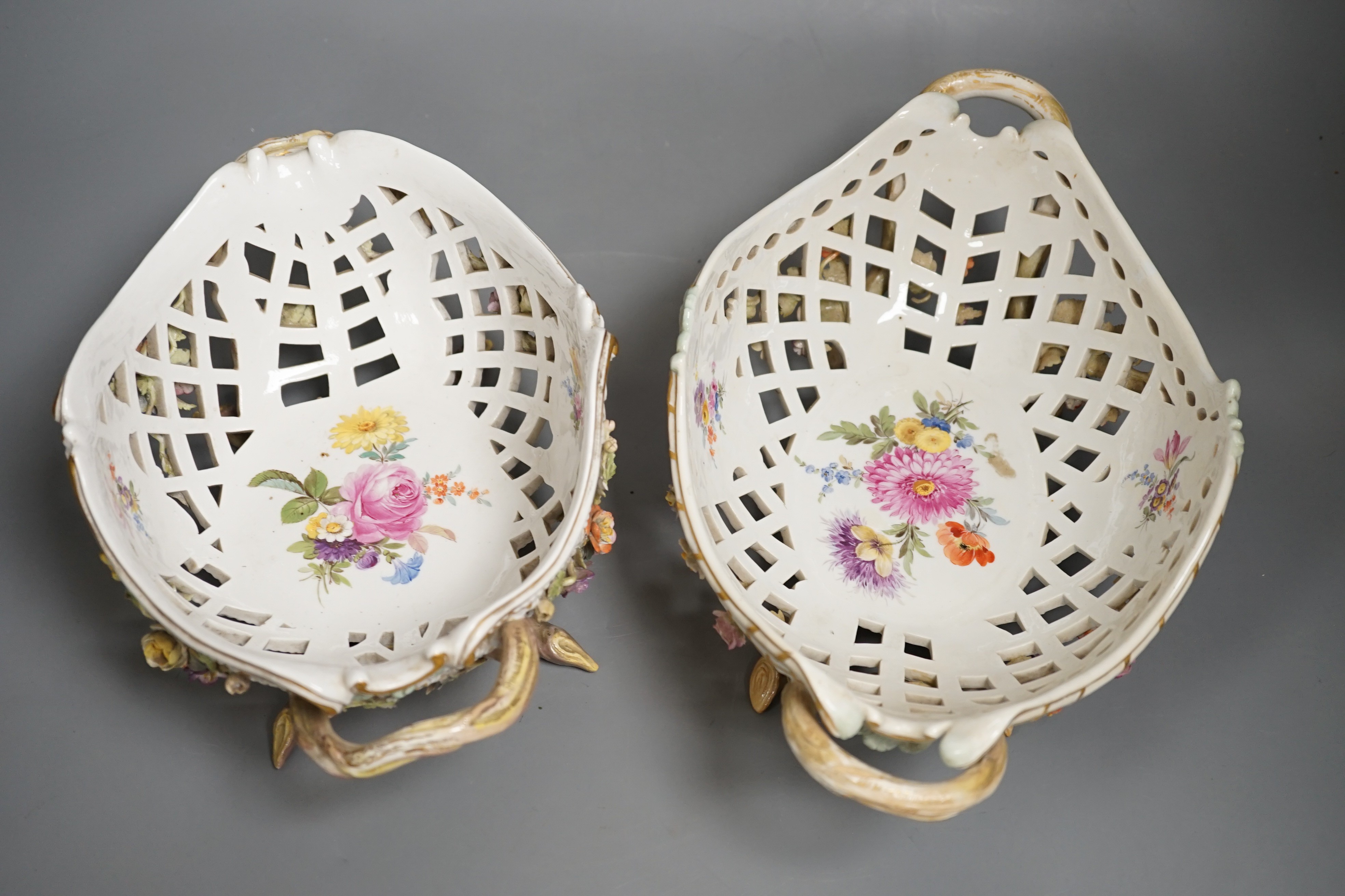 Two similar late 19th century Meissen floral encrusted pierced porcelain bowls 27cm